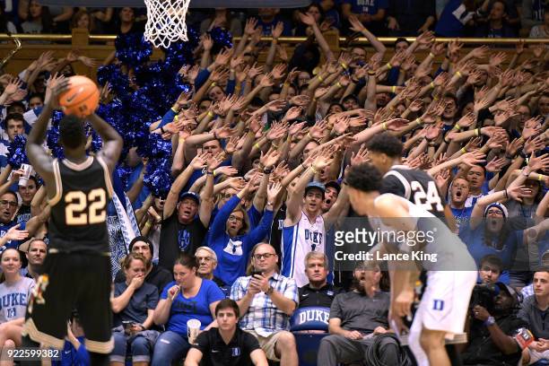 Cameron Crazies and fans of the Duke Blue Devils try to distract Deng Adel of the Louisville Cardinals at Cameron Indoor Stadium on February 21, 2018...