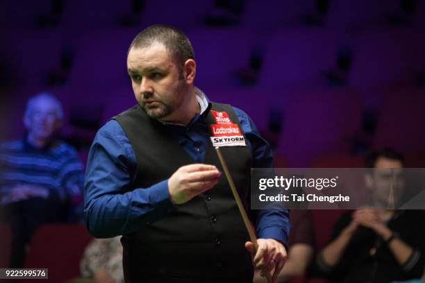 Stephen Maguire of Scotland chalks the cue during his second round match against Michael Georgiou of Cyprus on day three of 2018 Ladbrokes World...