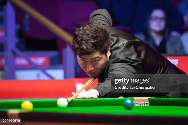Yan Bingtao of China plays a shot during his second round match against Ronnie O'Sullivan of England on day three of 2018 Ladbrokes World Grand Prix...