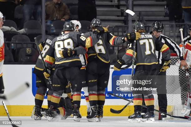 Reilly Smith celebrates his goal with his teammates Jonathan Marchessault, Nate Schmidt. William Karlsson and Colin Miller of the Vegas Golden...