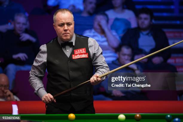 John Higgins of Scotland reacts during his second round match against Xiao Guodong of China on day three of 2018 Ladbrokes World Grand Prix at Guild...