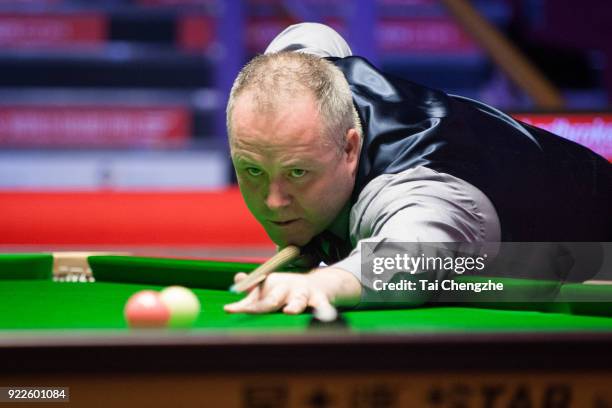 John Higgins of Scotland plays a shot during his second round match against Xiao Guodong of China on day three of 2018 Ladbrokes World Grand Prix at...