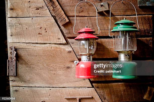 old-fashioned lanterns - tool shed wall spaces stockfoto's en -beelden