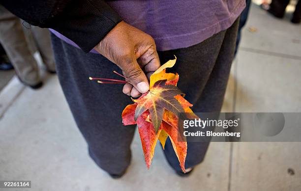 Philip Firmin, a 15 year resident of Stuyvesant Town, holds leaves as he speaks to other residents following a news conference in the Stuyvesant...