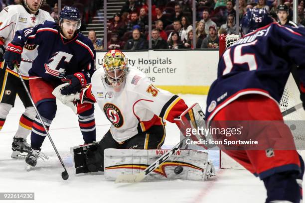 Stockton Heat goalie Mason McDonald makes a pad save during the second period of the American Hockey League game between the Stockton Heat and...