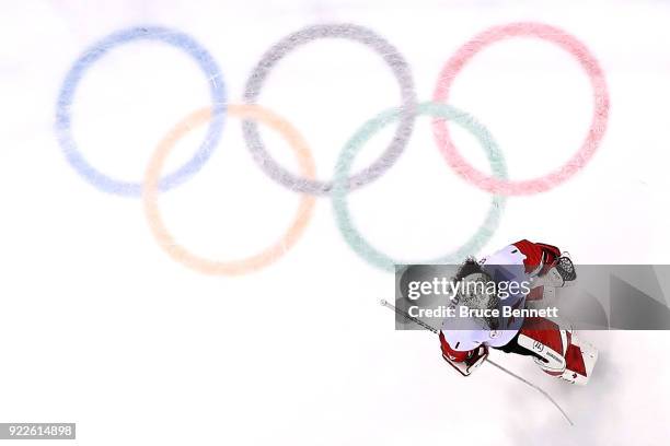 Shannon Szabados of Canada skates past the Olympic Rings in the first period against the United States during the Women's Gold Medal Game on day...