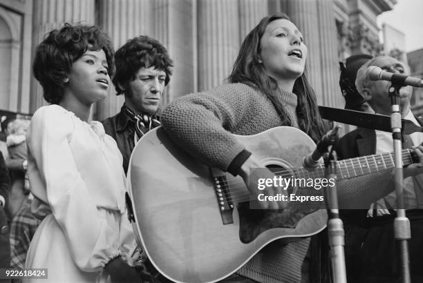 American soul singer PP Arnold, American-British singer Julie Felix sing at an anti H-Bomb demonstration, with British blues musician Alexis Korner ,...