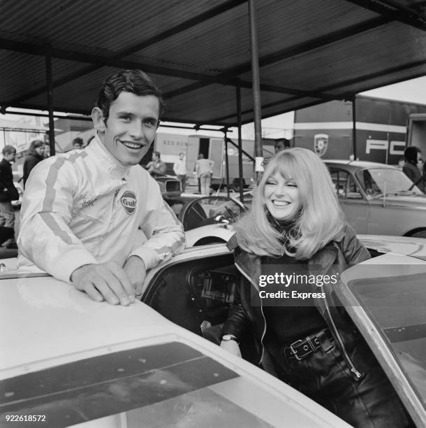 Belgian racing driver Jacky Ickx with rally driver Peta Seccombe at Brands Hatch, UK, 6th April 1968.