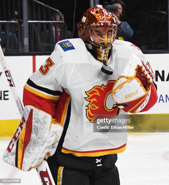 David Rittich of the Calgary Flames blocks a shot by the Vegas Golden Knights in the second period of their game at T-Mobile Arena on February 21,...