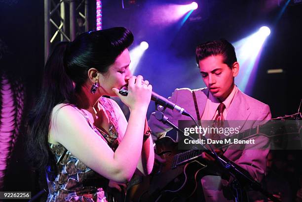 Kitty, Daisy & Lewis perform on stage during the launch party for the new limited edition Edun women's t-shirts and t-dresses hosted by Edun and...