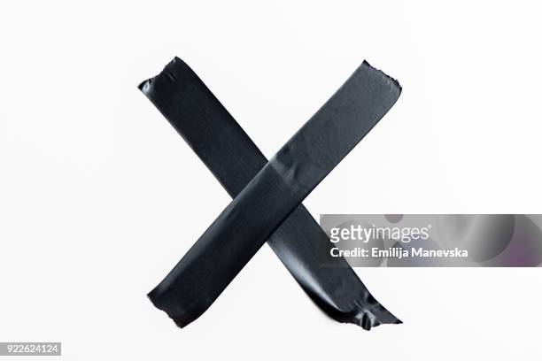 black electrical insulation tape - letter x stock-fotos und bilder