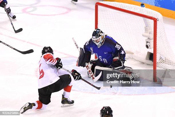 Melodie Daoust of Canada makes a shot on Madeline Rooney of the United States in the third period during the Women's Gold Medal Game on day thirteen...