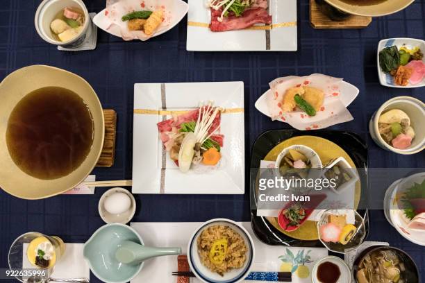 traditional japanese food, kaiseki cuisine with sukiyaki pot - ryokan stock pictures, royalty-free photos & images