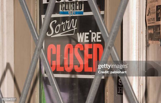 closed sign behind metal gate - store closing stock pictures, royalty-free photos & images