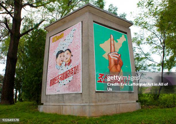 North Korean propaganda billboard for the reunification in the Demilitarized Zone, North Hwanghae Province, Panmunjom, North Korea on September 7,...