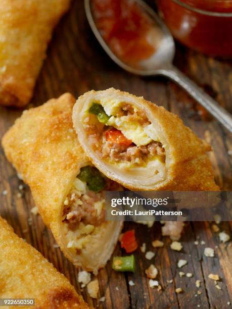 egg and sausage breakfast egg roll - corned beef omelet stock pictures, royalty-free photos & images