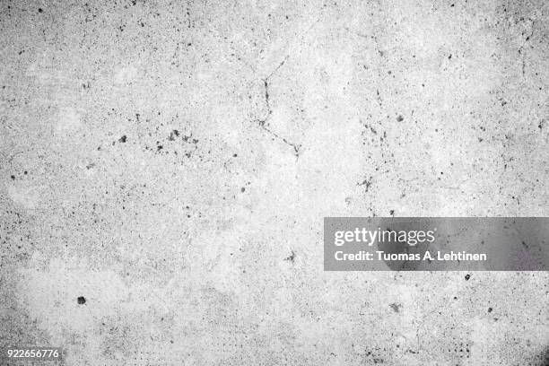 weathered and aged concrete wall texture background in black and white with vignette - grunge stock pictures, royalty-free photos & images