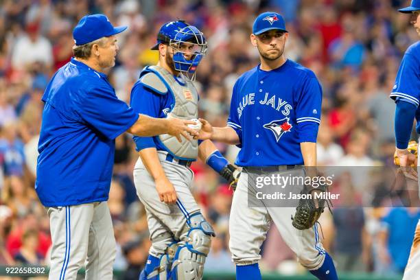 Manager John Gibbons of the Toronto Blue Jays removes starting pitcher Marco Estrada during the fifth inning against the Cleveland Indians at...