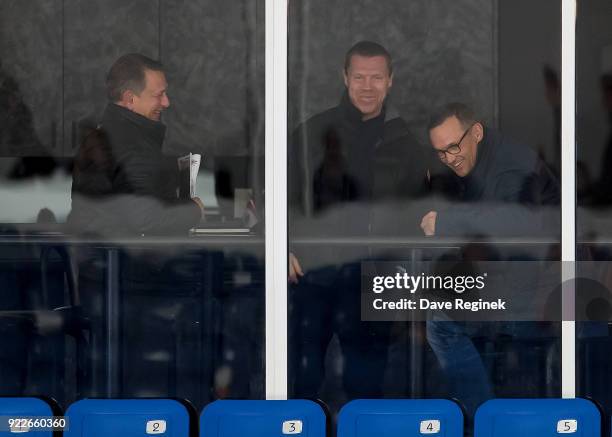 From General Manager's Ken Holland, Kris Draper and Steve Yzerman, General Manager from the Tampa Bay Lightning, share a laugh while they watch the...