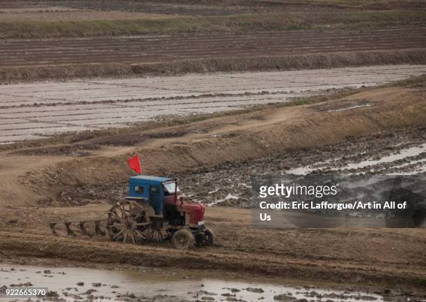 Old North Korean tractor in a field in the countryside, Pyongan Province, Pyongyang, North Korea on April 30, 2010 in Pyongyang, North Korea.