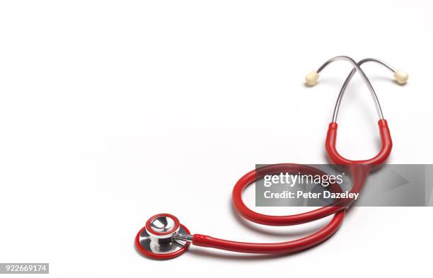 close up of a red stethoscope with copy space - red stethoscope stock pictures, royalty-free photos & images