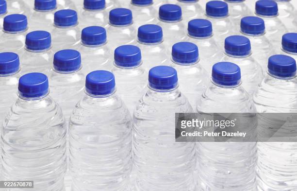 production line of drinking water bottles - bottle water fotografías e imágenes de stock