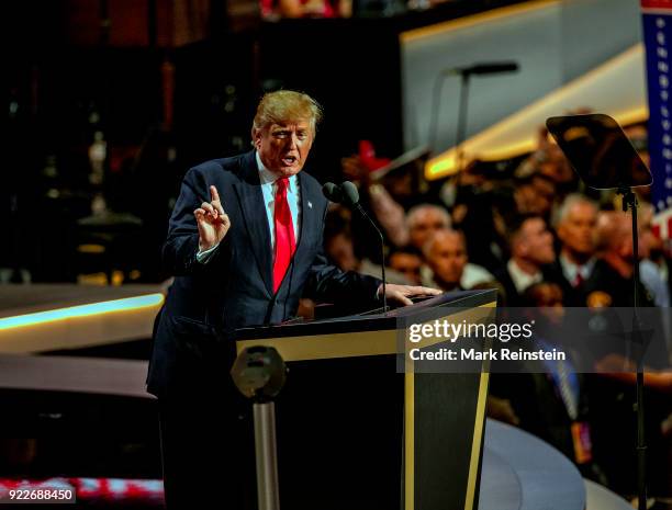 View of American real estate developer and presidential candidate Donald Trump at a podium as he addresses the Republican National Convention on its...