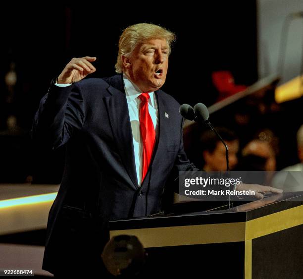 View of American real estate developer and presidential candidate Donald Trump at a podium as he addresses the Republican National Convention on its...