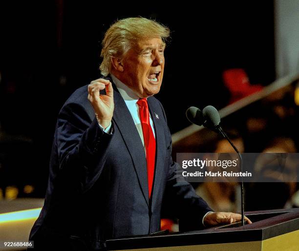 View of American real estate developer and presidential candidate Donald Trump at a podium as he addresses the Republican National Convention on its...