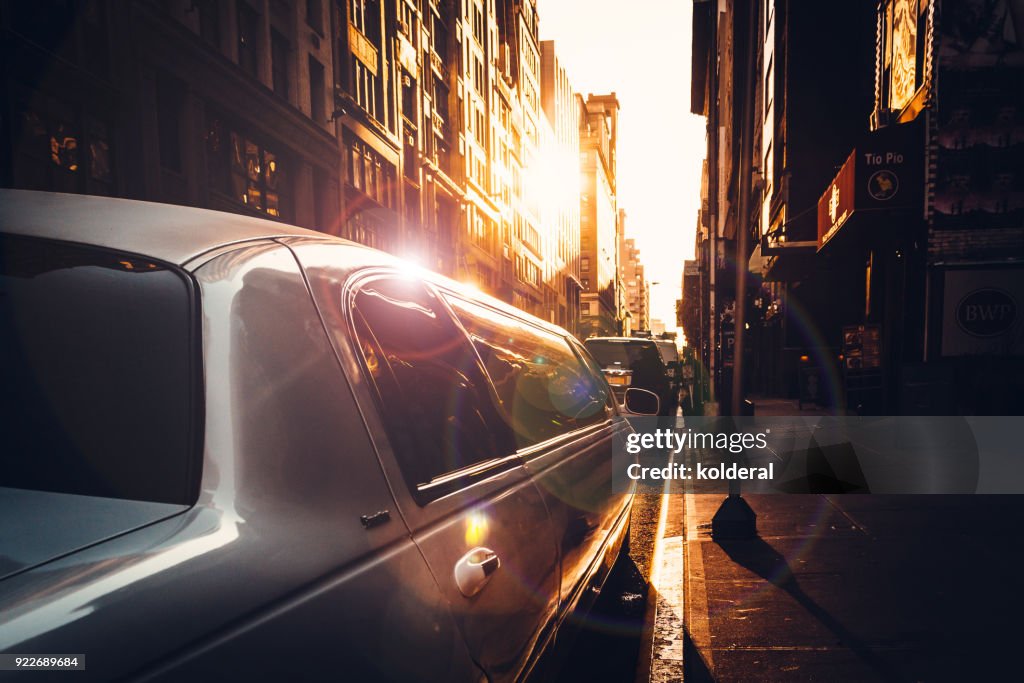 White limousine parking on street in Midtown Manhattan