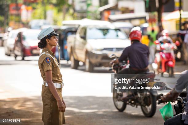 policewomen regulate traffic - pinnawela stock pictures, royalty-free photos & images