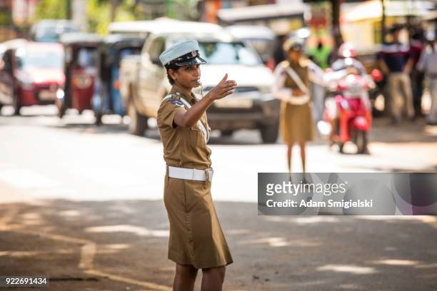 policewomen regulate traffic - pinnawela stock pictures, royalty-free photos & images