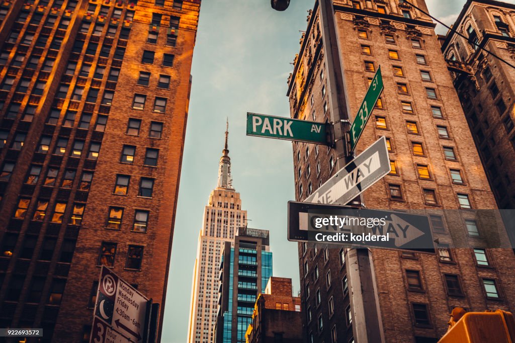 Urban skyline in Midtown Manhattan with distant view of Empire State Building