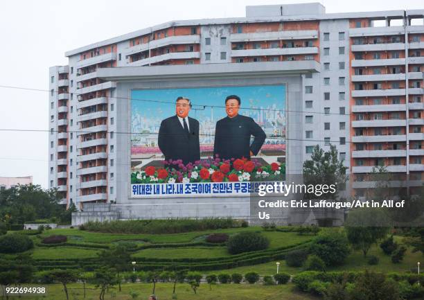 Kim il Sung and Kim Jong il on a propaganda fresco in the city saying my great country my homeland, Pyongan Province, Pyongyang, North Korea on...