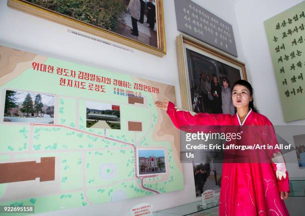 North Korean guide in red choson-ot dress in the agriculture university, South Hamgyong Province, Hamhung, North Korea on September 11, 2012 in...