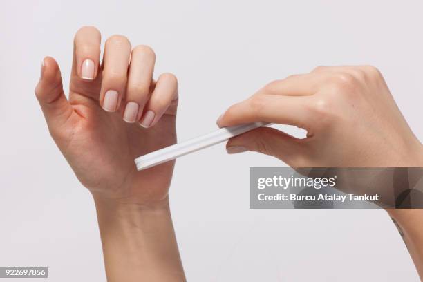 woman doing manicure - französische maniküre stock-fotos und bilder