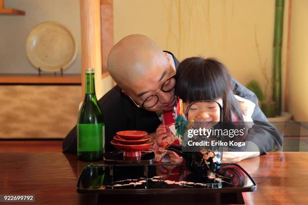 Father And Daughter In Kimono Acting Funny High-Res Stock Photo