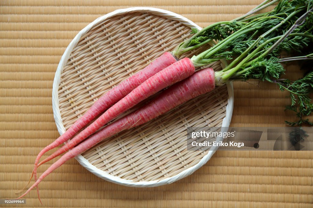 Red carrots of Kyoto putting on woven bamboo tray