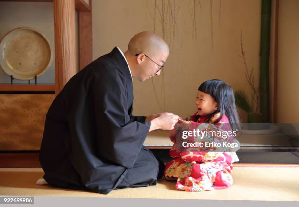 Father Giving New Years Gift Of Money Called Otoshidama To Daughter High-Res Stock Photo