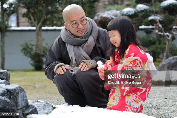 father and daughter playing with snow - kimono winter stock pictures, royalty-free photos & images