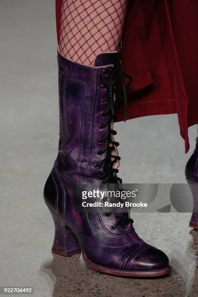Classic Anna Sui thick heeled laceup boots and fishnet stockings on the runway during the Anna Sui fashion show; February 2018 - New York Fashion...