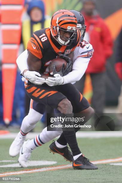 Green of the Cincinnati Bengals runs the football upfield against Kyle Fuller#23 of the Chicago Bears during their game at Paul Brown Stadium on...