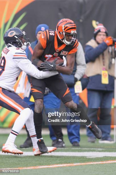 Green of the Cincinnati Bengals runs the football upfield against Eddie Jackson of the Chicago Bears during their game at Paul Brown Stadium on...