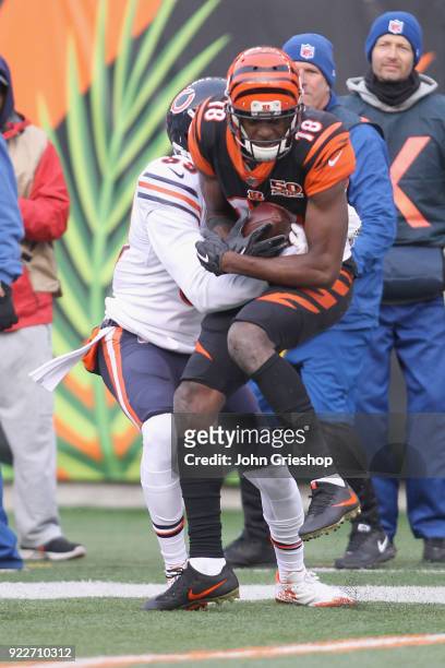Green of the Cincinnati Bengals runs the football upfield against Eddie Jackson of the Chicago Bears during their game at Paul Brown Stadium on...