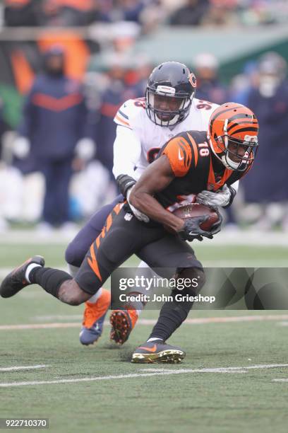 Green of the Cincinnati Bengals runs the football upfield against DeAndre Houston-Carson of the Chicago Bears during their game at Paul Brown Stadium...