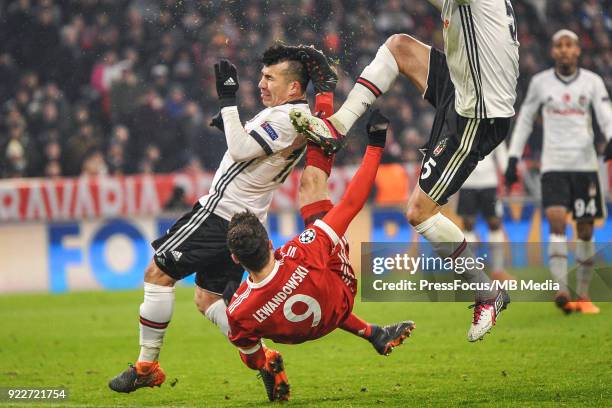 Gary Medel of Besiktas and Robert Lewandowski of Bayern Muenchen in action during the UEFA Champions League Round of 16 First Leg match between...