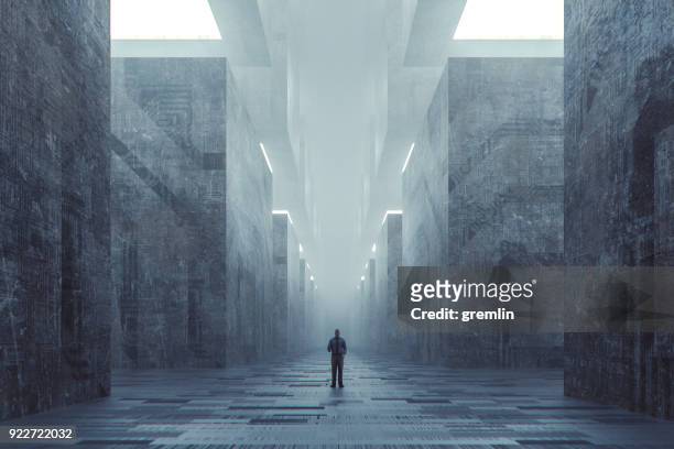 Lost businessman in futuristic dark ominous concrete city