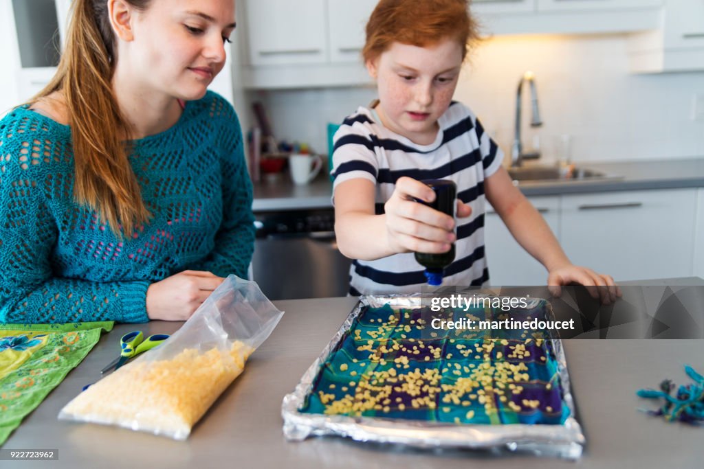 Girls making reusable eco-friendly food wrap.