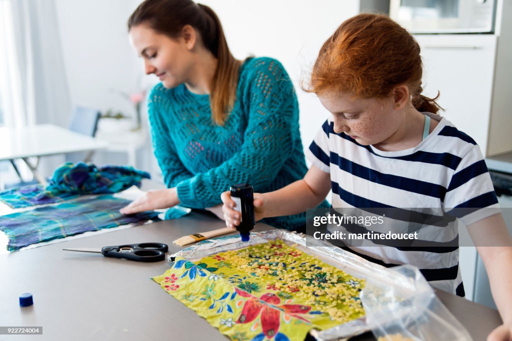 Girls making reusable eco-friendly food wrap.