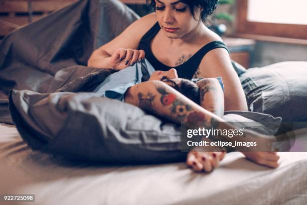 small talk... - lesbian bed stock pictures, royalty-free photos & images